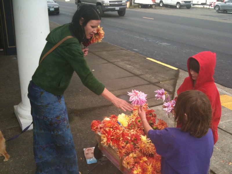 Darka getting flowers from children