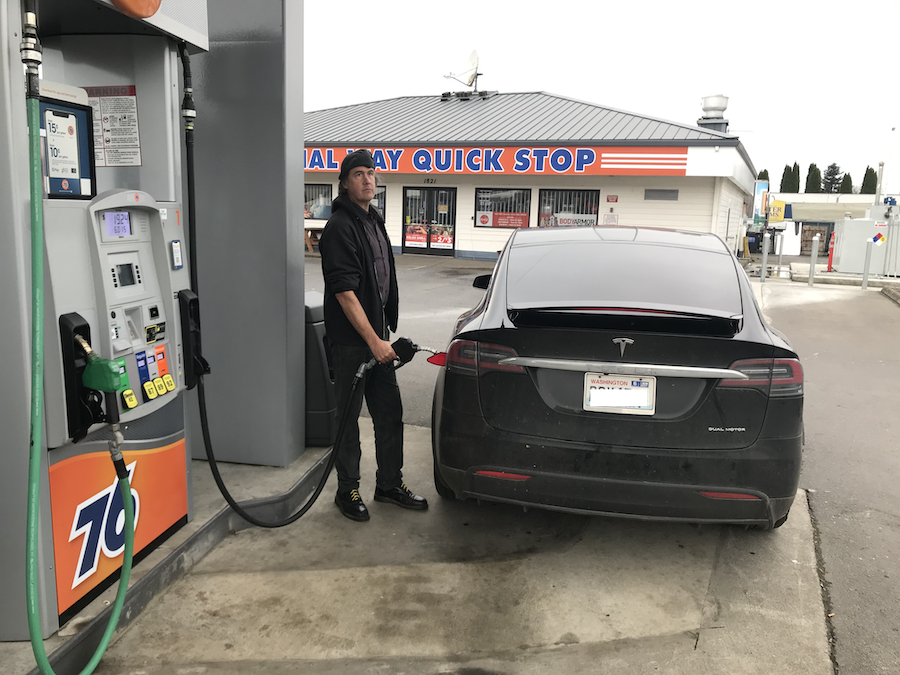 Tesla at gas pump