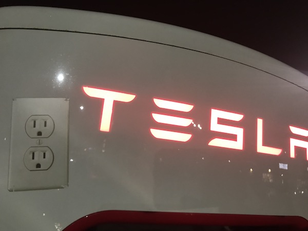 AC sticker on Tesla Charger.